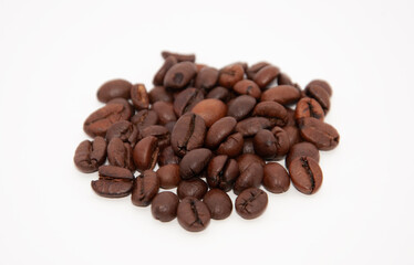 Roasted coffee beans isolated on a white cutout background