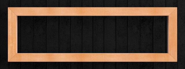 Picture of natural wood slats on a background of matte black boards. Wide version.
