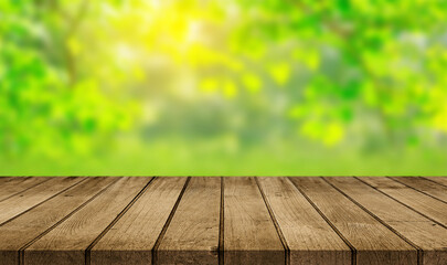 wooden table and green nature bokeh background.