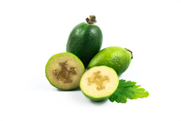 Tropical feijoa or acca sellowiana, pineapple guava fruit ripe and cut on white isolated background