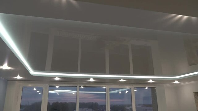 suspended ceilings and plasterboard structures in the decoration of an apartment or house. Dolly video. Led lighting.
