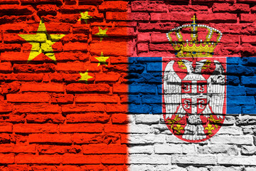 Flag of China and Serbia on brick wall