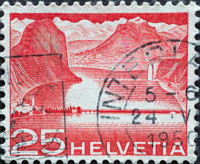 Switzerland - Circa 1949 : a postage stamp printed in the swiss showing the dam at Melide (Lake...