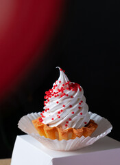 cup cake tart white paper box red table black background