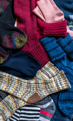 Selection set various sock bright wool a lot top view background