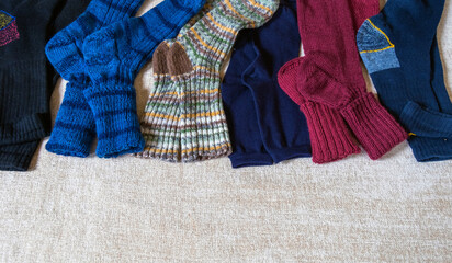Selection set various sock bright wool a lot top view background