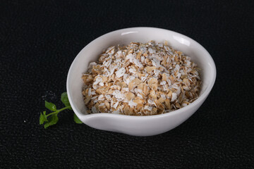 Raw oats in the bowl