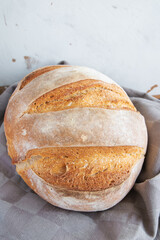 Homemade round bread of wheat flour and spelt