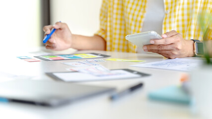 UX UI applications designer working for smart phone interface..