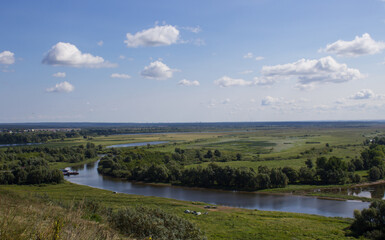 Obraz premium Magnificent natural landscape with forest, field and river