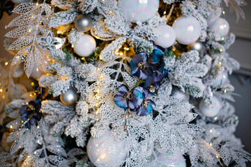 White Christmas tree with blue Orchid branch