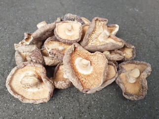 shitake mushrooms on a black background