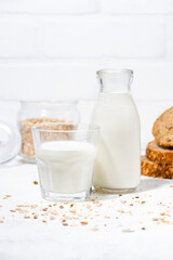 fresh milk and whole grain bread slices, vertical