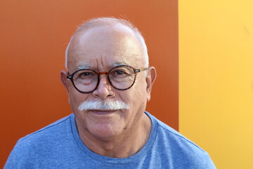 Ethnic senior man with a mustache and eyeglasses
