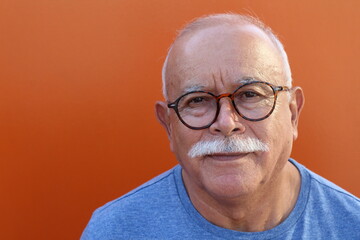 Ethnic senior man with a mustache and eyeglasses
