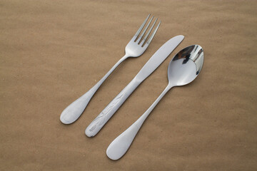Fork, knife and spoon on a table.