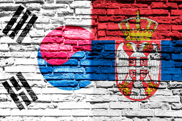 Flag of South Korea and Serbia on brick wall