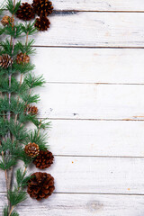 Happy New Year greeting card. Christmas branches on rustic wooden background. Space for text. Top view