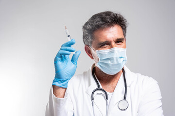 Study of COVID-19 infection. Male doctor examines medicine for illness.