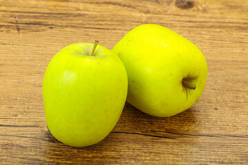 Two ripe green sweet apples
