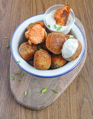 Croquettes with piquillo peppers and bechamel. Spanish vegetarian croquettes as a tapa dish with dipping sauce. 