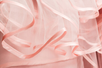 Wedding dress detail. Pink wedding dress frills close up.