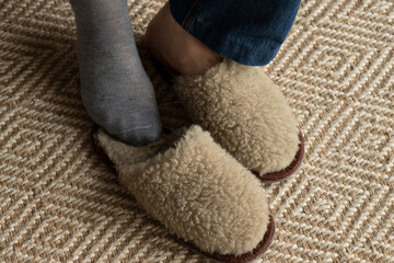 Wearing comfortable warm socks and slippers at home.