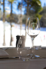 View from the restaurant with glasses of wine to the snowy slopes.