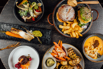 A top view of a restaurant table with delicious gourmet foods.