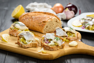 sandwiches with herring, onion and cucumber