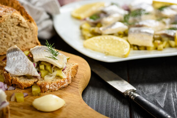 sandwiches with herring, onion and cucumber