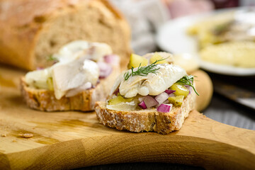 sandwiches with herring, onion and cucumber
