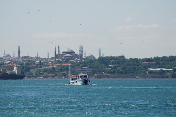 Fototapeta na wymiar Boat on Sea in Front of Istanbul Landscape