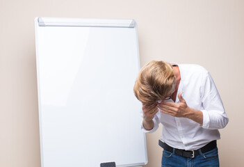 adult blonde businessman with a board