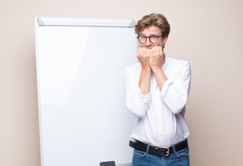 adult blonde businessman with a board