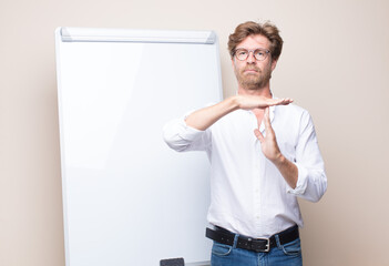 adult blonde businessman with a board