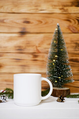 White cup  Christmas mock up, New Year decorations, candles and tree