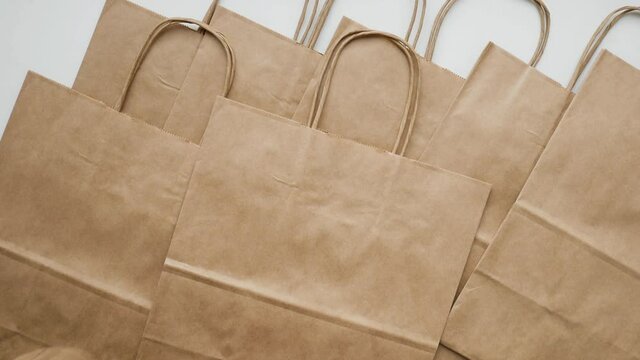 Eco packaging. Kraft bags from renewable biodegradable sources. Copy space. Top view