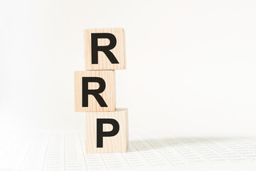 word RRP on wooden blocks, white background, business concept. business and Finance