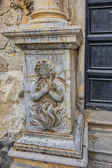 Carved Baroque portal of Santo Stefano Church also known as church of Purgatory (Chiesa del Purgatorio, 1668) at Piazza Giovanni in Cefalu, Sicily, Italy.