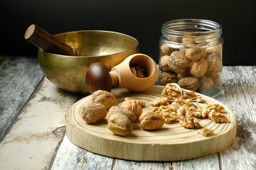 Nuts on wooden trunk with nutcracker