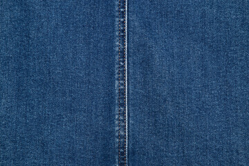 Naklejka premium Blue background, denim jeans background. Jeans texture, fabric. Texture Jeans. Close Up Of Blue Jeans Fabric Macro With External Seams Yellow