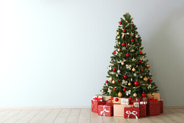 Beautiful interior decorated for Christmas or New Year. Christmas tree and gifts. Place for text