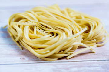 Closeup view of a Pile Of Uncooked Rolled Traditional Italian Pasta
