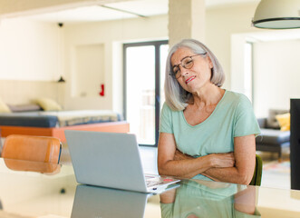 middle age woman feeling anxious, ill, sick and unhappy, suffering a painful stomach ache or flu