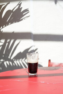 A Half Pint Of Guinness Outside On A Table.