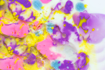 Closeup abstract color mixing of water, acrylic, oil and milk