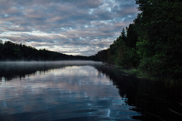 Mist on The Spanish River in Massey Ontario with cloudy sky