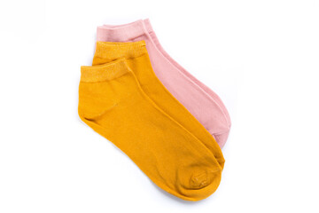 two pairs of colored short socks on a white background, top view