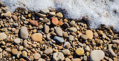 Pebble stones in the sea. Great as a background.